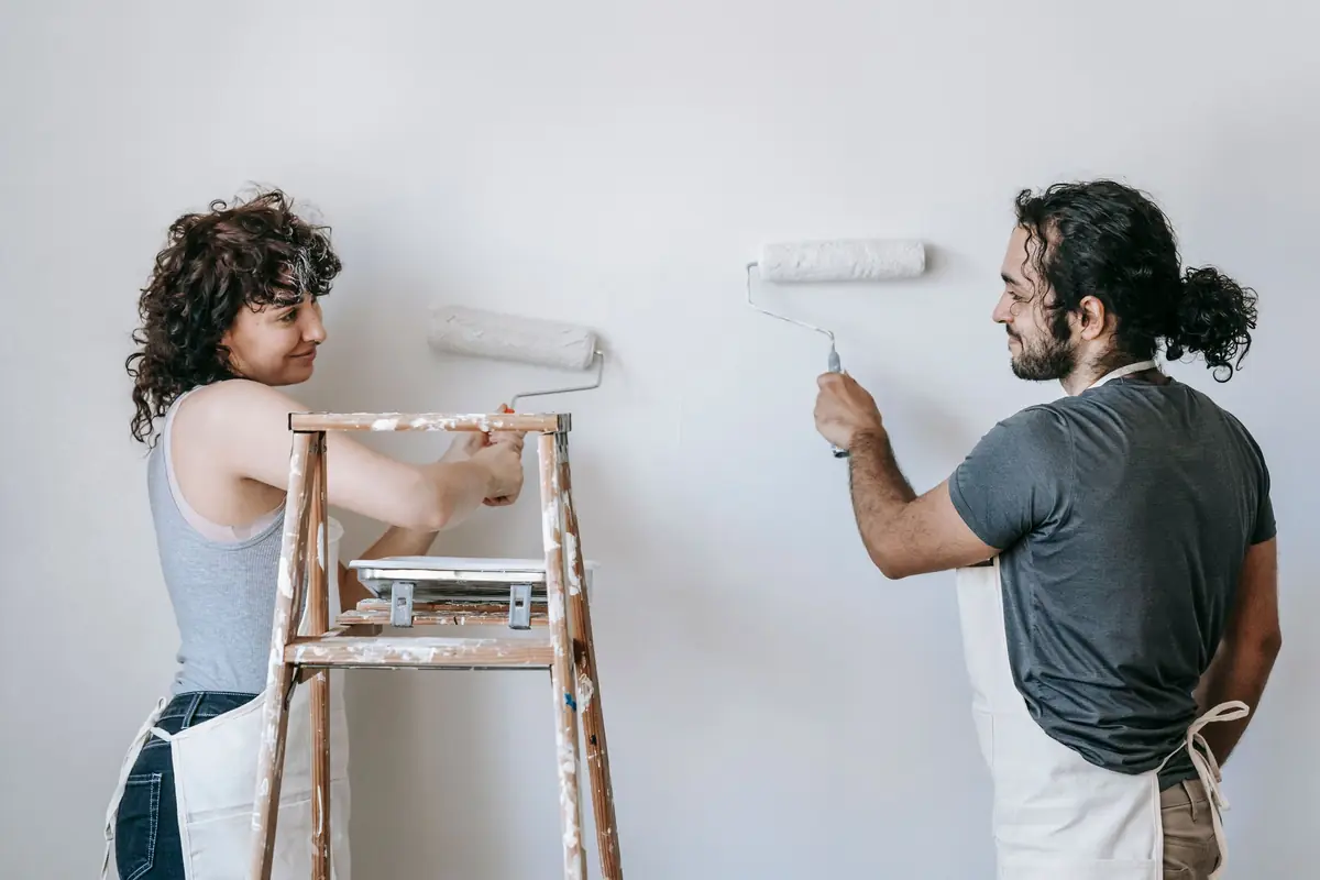 People painting a wall together — painting help in Lubbock